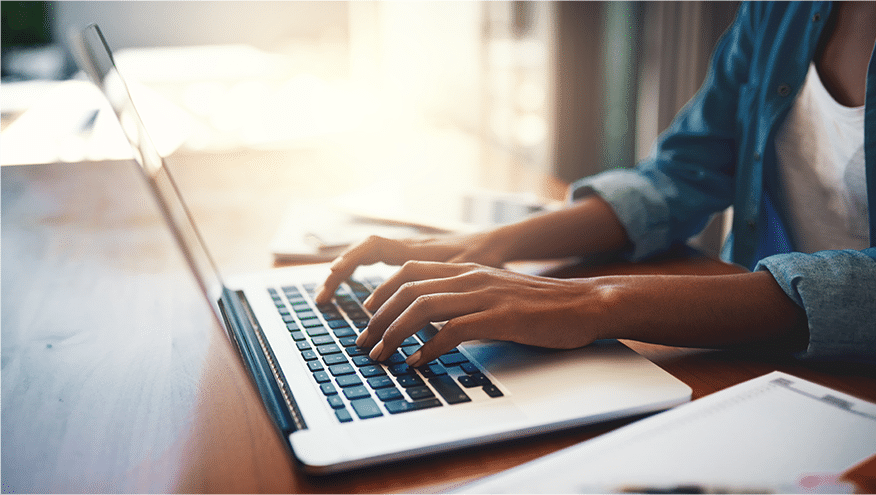 Woman typing on laptop